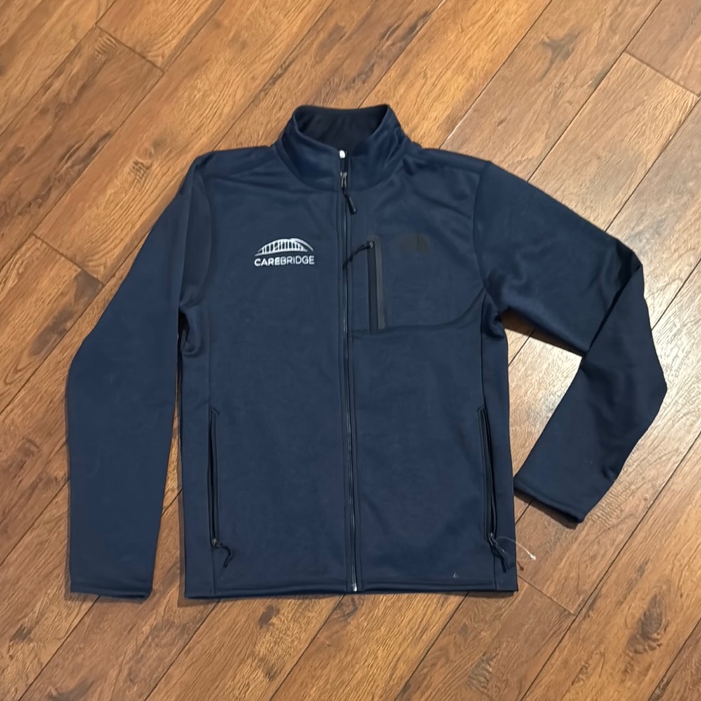 The North Face Blue Performance Jacket with Weather-Resistant Fabric